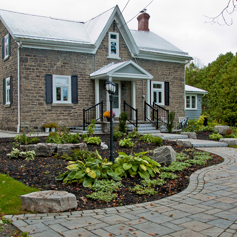 Entrance landscaping with gardens