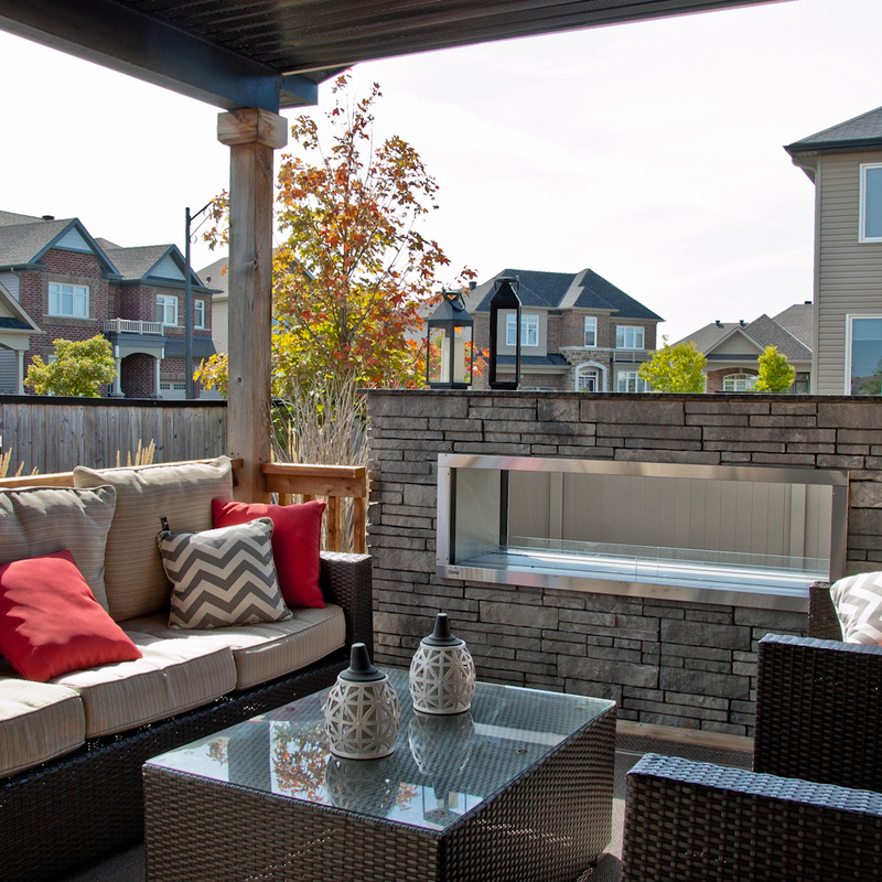 Backyard landscaping with gas fireplace